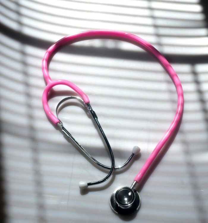 Pink stethoscope symbolizing medical supervision in ibogaine treatment