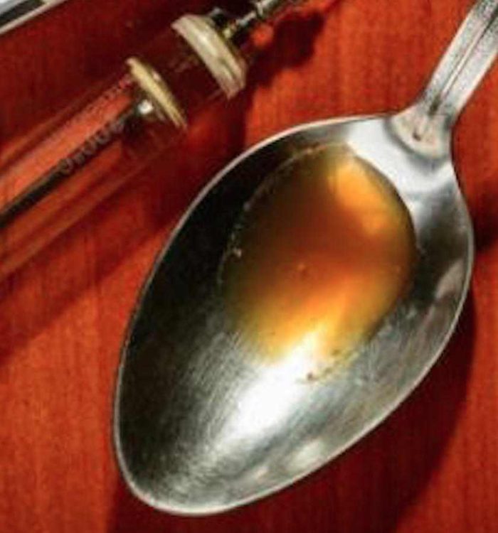 heroin spoon needle and drug paraphenilia